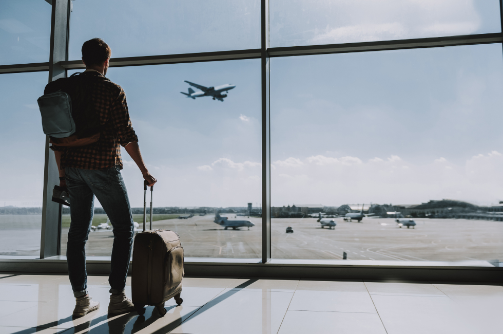 Great Getaway Travel | Local Travel Agency | Person Waiting at an Airport to Take a Vacation